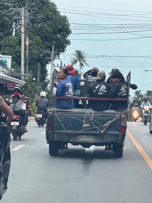 Pickup trucks and mixed traffic flow through Ko Samui streets