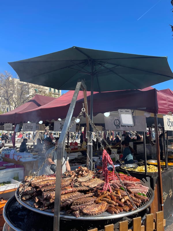 Street food vendor serves grilled meats in Barcelona