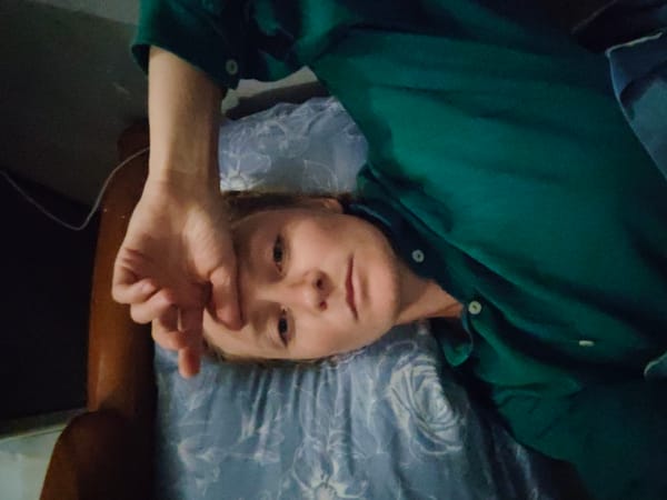 Person resting on floral pillow in Hanoi bedroom