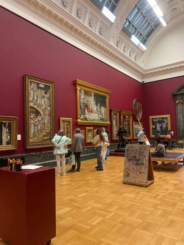 Visitor documents classical paintings during London gallery tour