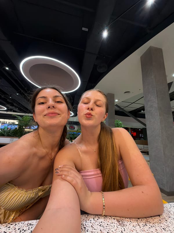 Two women take selfies together in Burgas, Bulgaria