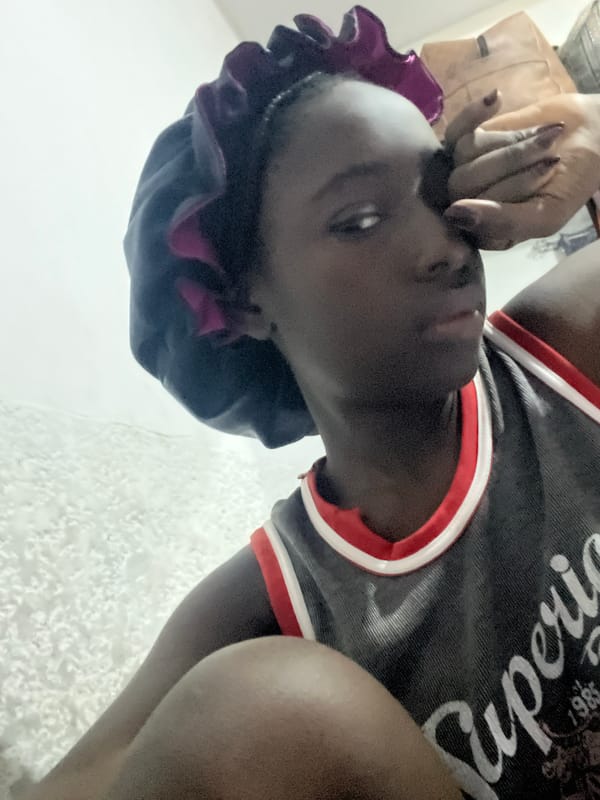 Person photographed indoors in early morning Abuja session