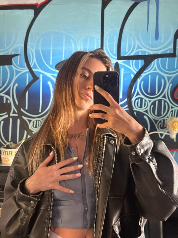 Selfies and street art details at a Moscow graffiti wall
