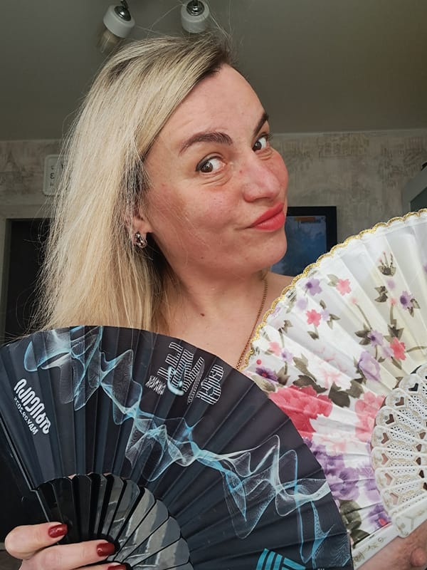 Woman displays decorative fans in Elektrostal, Russia