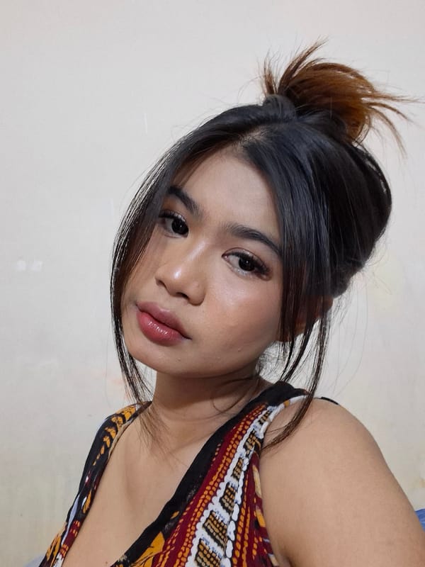 Quick portrait session in Kuta, Bali — bold makeup, colorful top