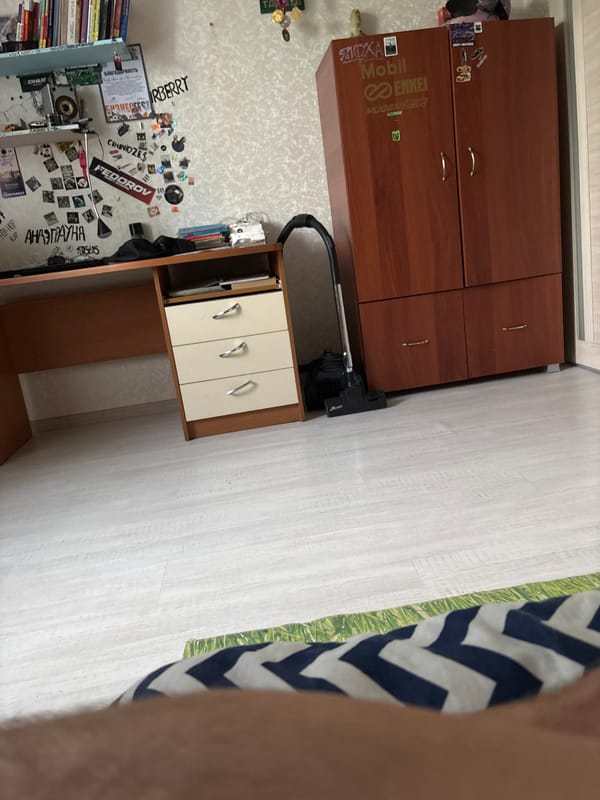 Young person's casual afternoon moments captured in bedroom setting