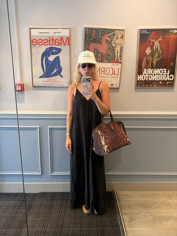 A Paris morning: cafés, classic facades, and carry-on luggage