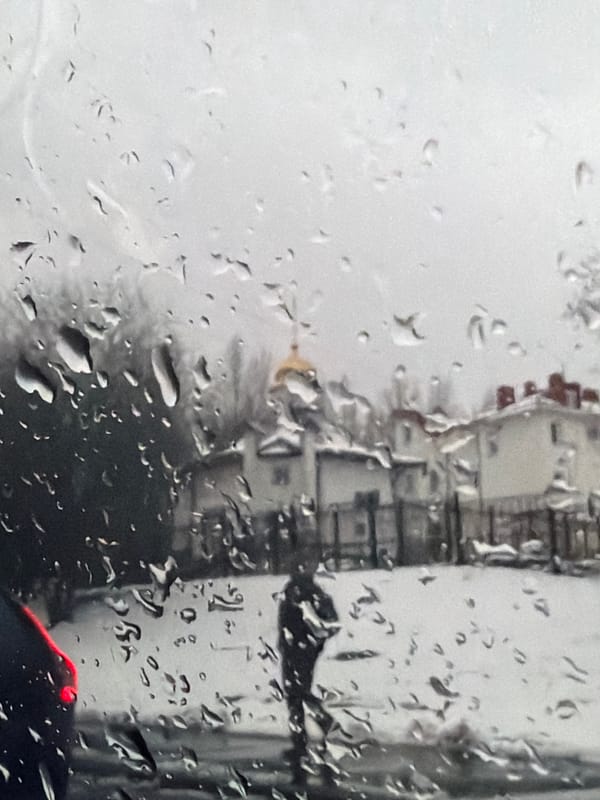 Rainy day view of Moscow captured through vehicle window