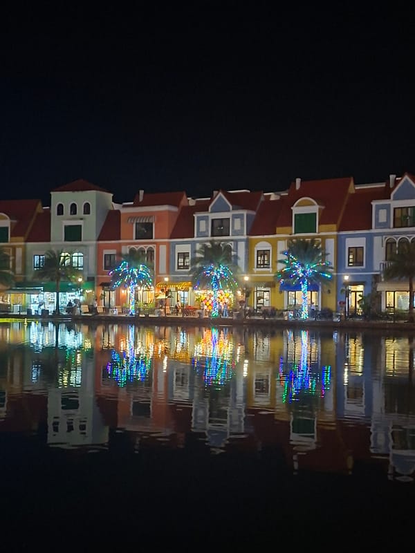 Grand World Phú Quốc lit up at night, statues and waterfront