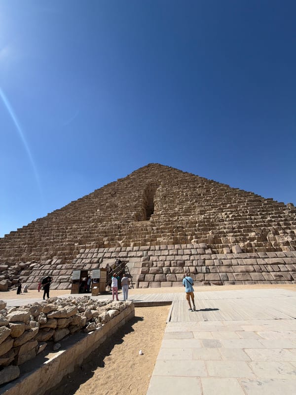 Morning at the Giza pyramids: stones, souvenirs, and camels