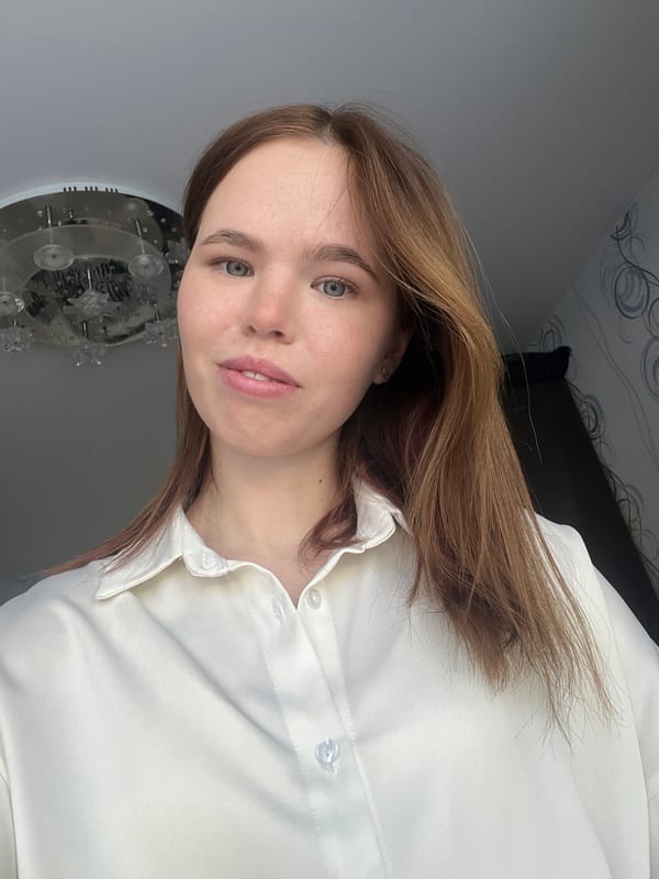 Woman documents morning routine with pet cat in Chaikovsky residence
