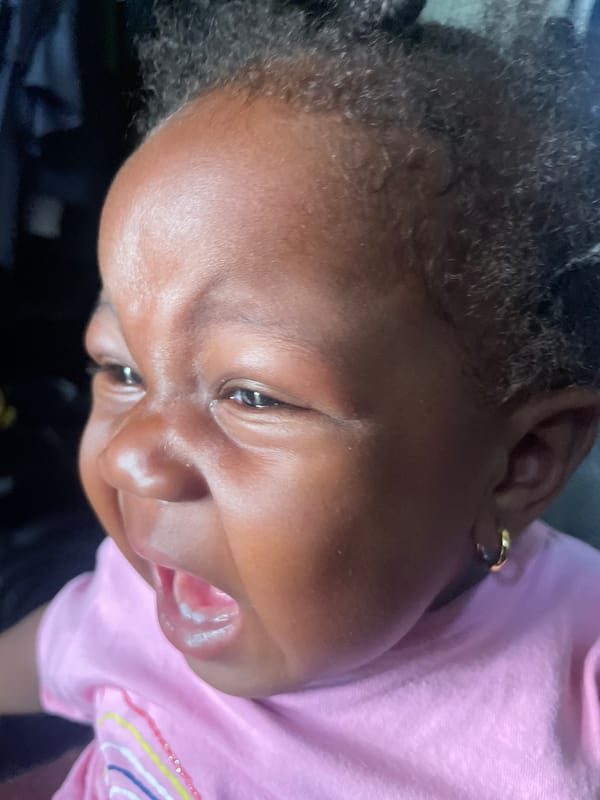 Baby photographed on couch in Lokoja, Nigeria