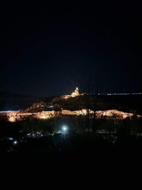 Historic Tsarevets Fortress illuminated at night in Bulgaria