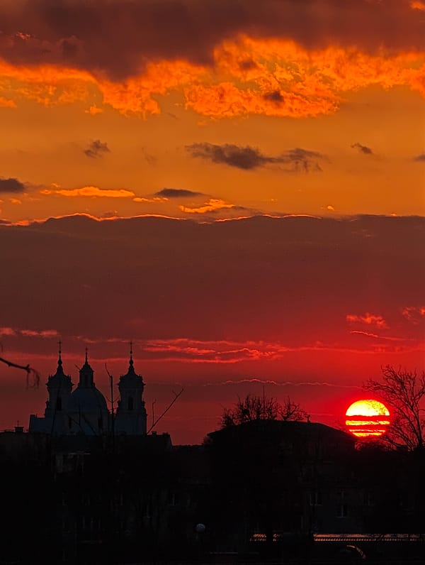 Dramatic sunset silhouettes church in Hrodna, Belarus