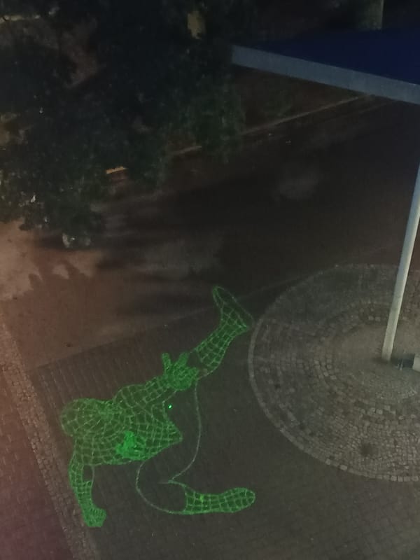 Green laser Spider-Man projection lights up Berlin surfaces at night