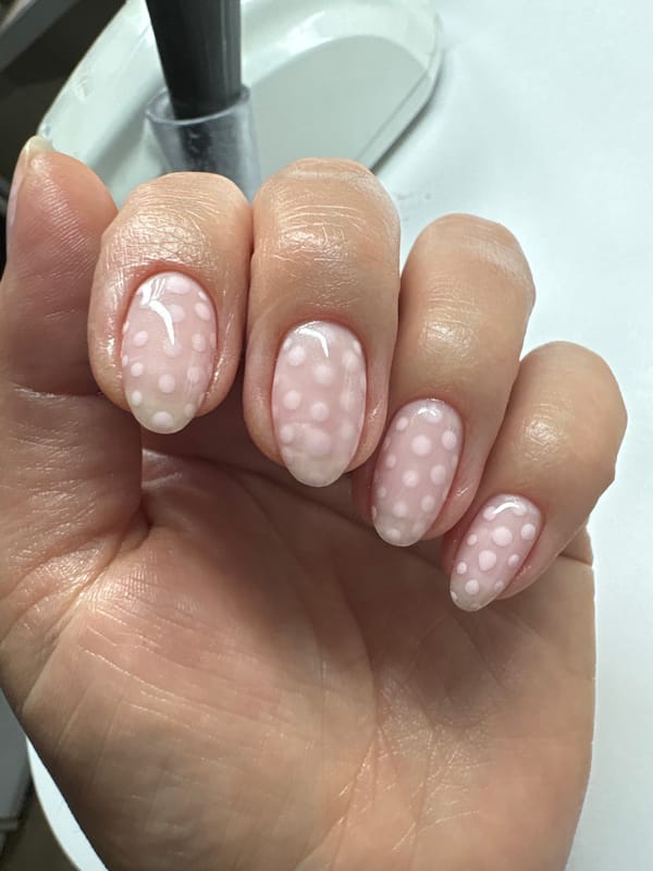 Polka dot manicure session documented in Kyiv beauty salon