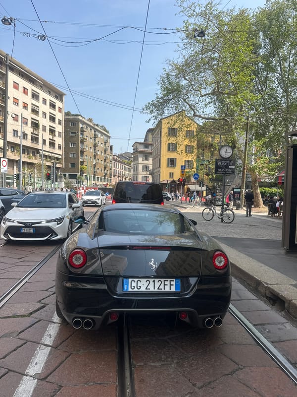 Black Ferrari spotted parked on Milan street with tram tracks