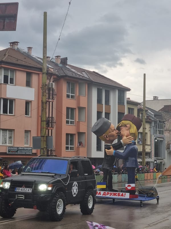 Parade with political floats proceeds through Gabrovo, Bulgaria
