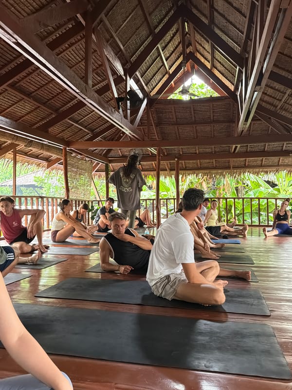 Yoga class held in thatched-roof pavilion in General Luna