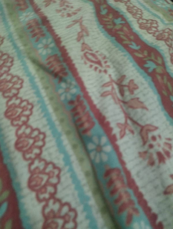 Patterned fabrics and accessories spread out for review