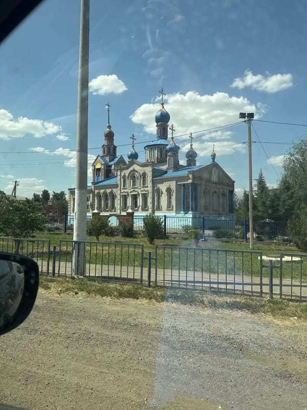 Blue-domed brick Orthodox church in Kisliakovskaya, Russia