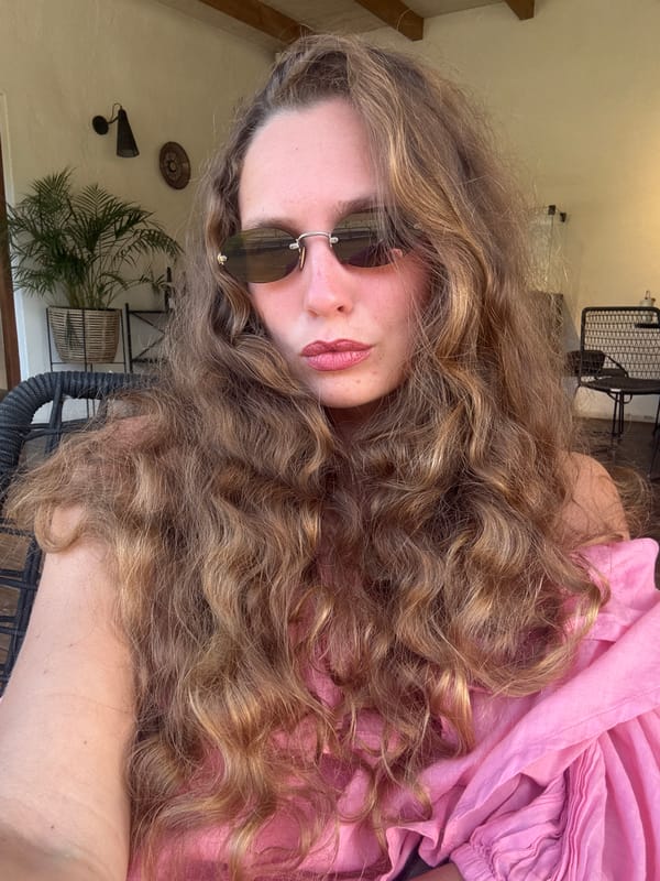 Woman takes selfie outdoors in Stellenbosch, South Africa