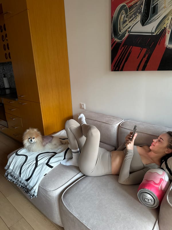 Woman relaxes on sofa in Warsaw apartment