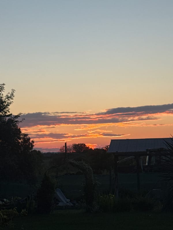 Rural sunset captured near Generalovo, Bulgaria with agricultural buildings