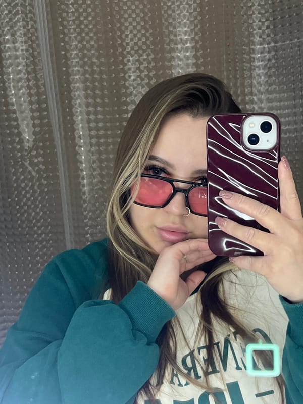 Young women take selfies indoors in Krasnodar, Russia