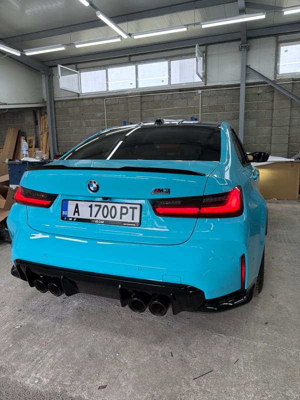 Blue BMW M3 Competition parked indoors, Burgas, Bulgaria
