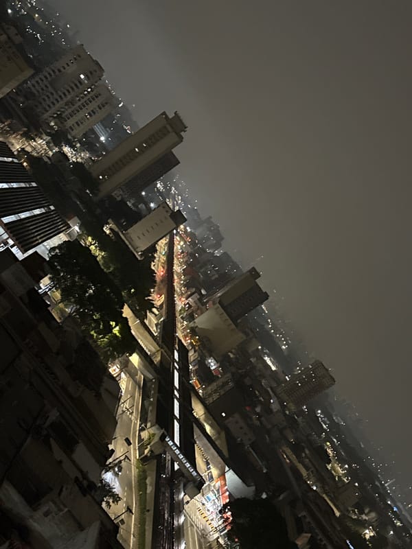 Foggy nighttime aerial view captured over São Paulo skyline