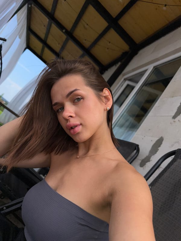 Casual outdoor portrait session on a balcony in Лобаново