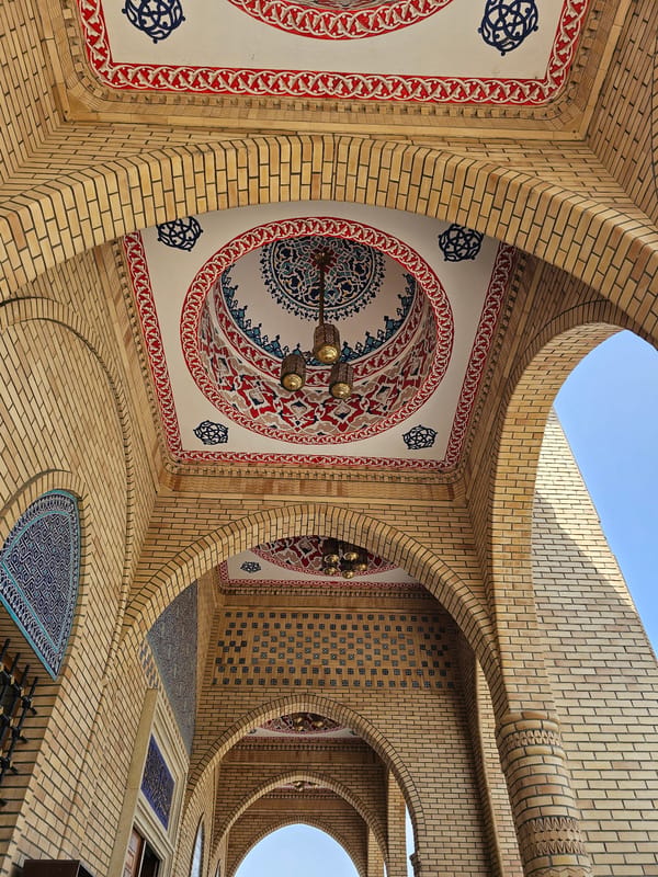 Inside and outside a mosque in Özgön, Kyrgyzstan