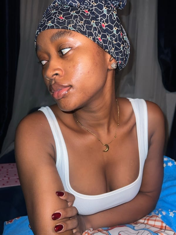 Woman poses for bedroom photos in Lagos