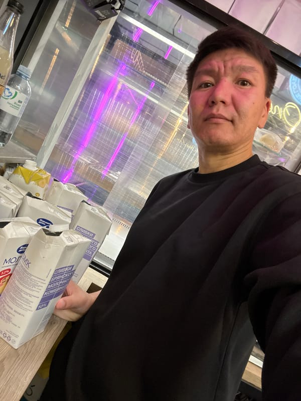 Selfie session inside a Moscow café, July 2026