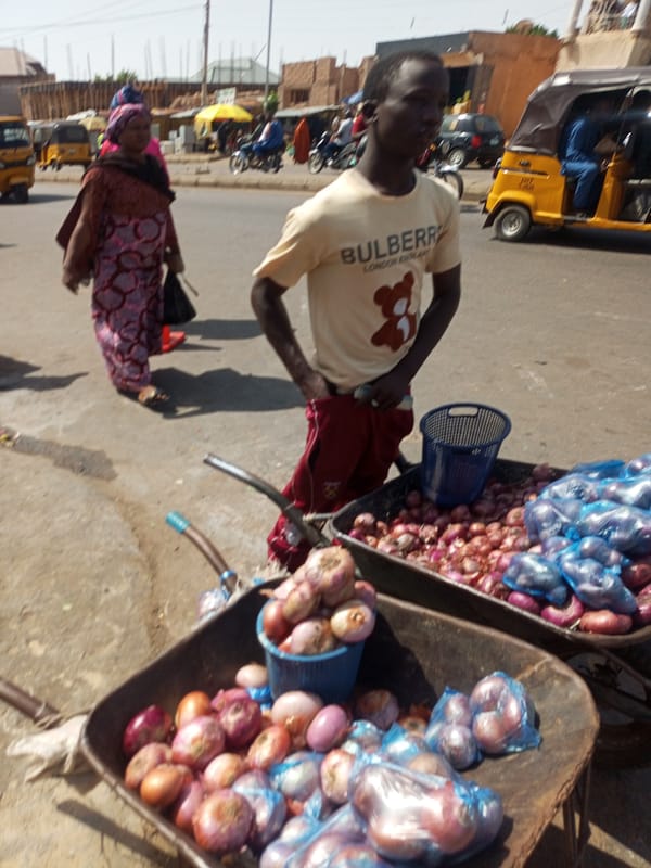 Busy outdoor market documented during morning hours June 4