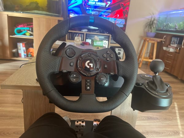 Gamer plays Gran Turismo 7 with racing wheel setup