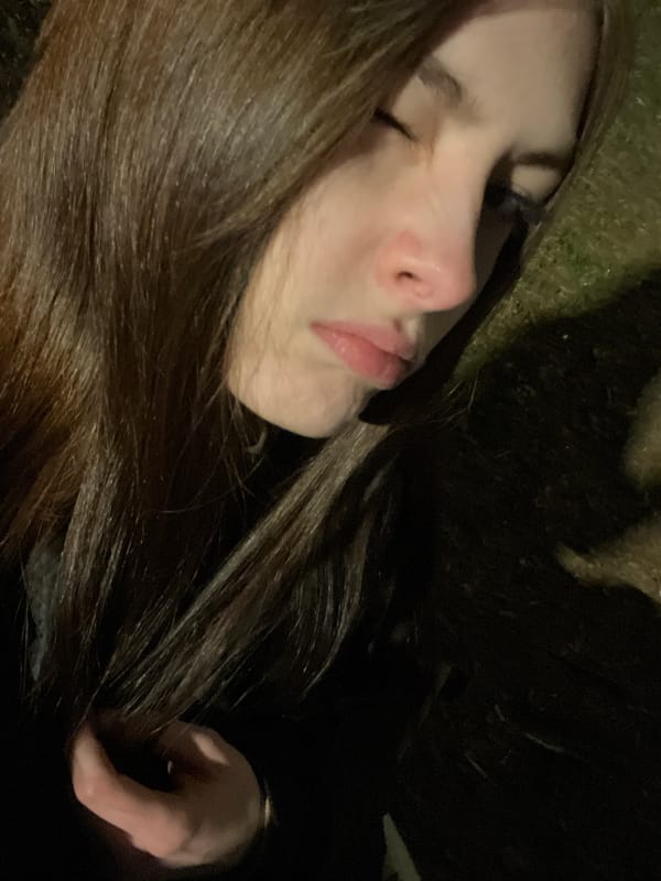 Woman resting on grass captured in Saint Petersburg