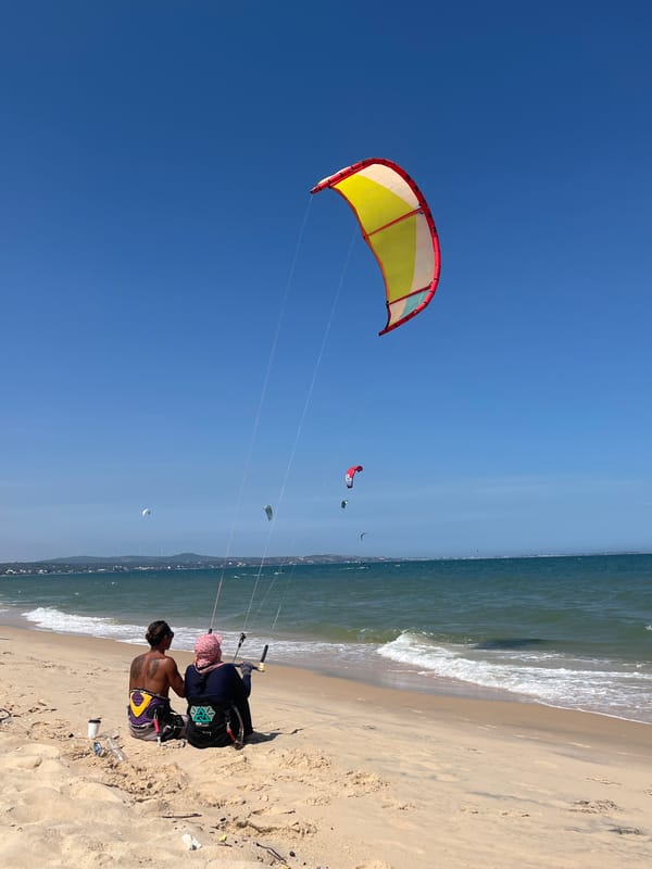 Kitesurfing and beach life along Mũi Né's coastline at dawn