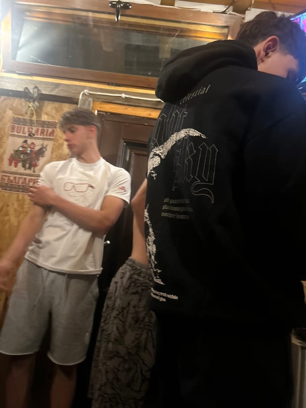 Young men gather for casual football viewing party