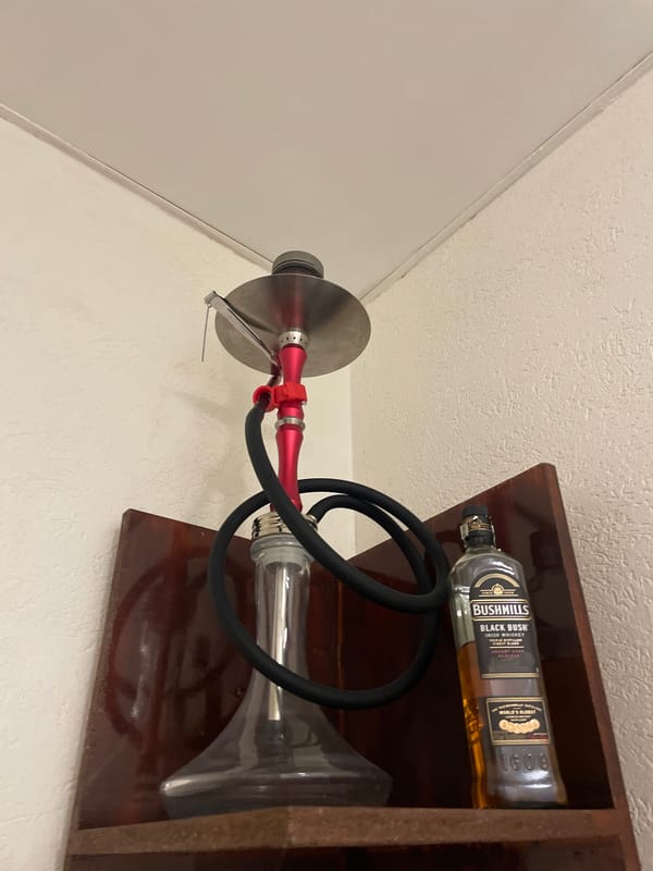 Hookah and Irish whiskey displayed on shelf in Sofia