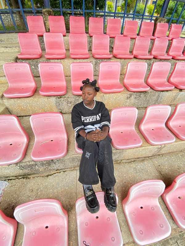 Young person photographed at various spots around Zawan, Nigeria