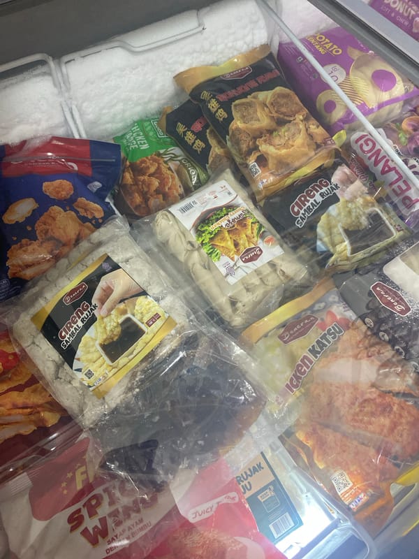 Browsing a stocked convenience store with live chickens nearby