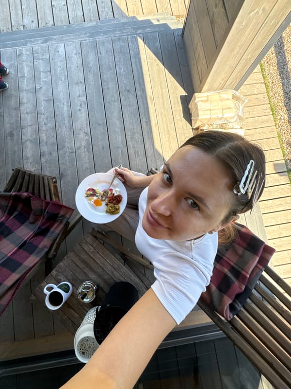 Woman enjoys outdoor breakfast in Литвиново, Russia