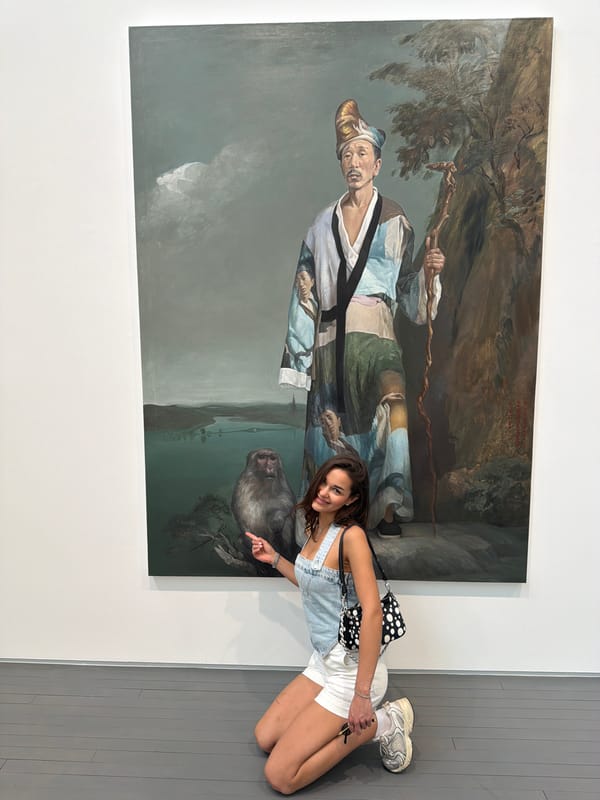 Gallery visitors pose with diverse art displays in Beijing