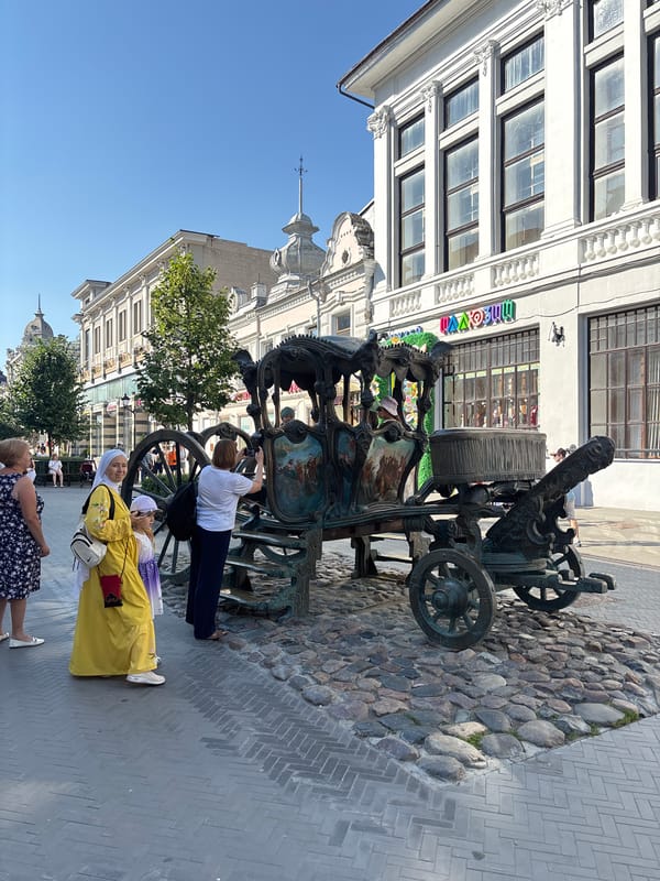 Bauman Street's sculptures, cafes, and street life on a July afternoon