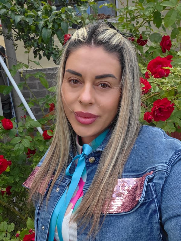 Portrait in front of red roses, Ravnogor, Bulgaria