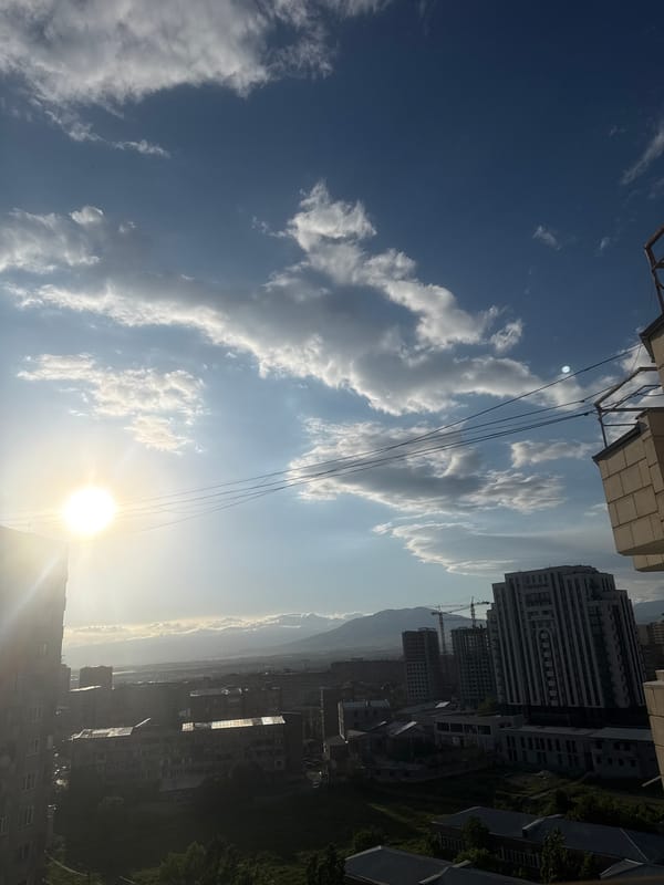 Witness documents sunny afternoon sky views from Abovyan balcony