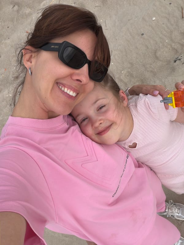 Mother and child enjoy sunny beach picnic in Latvia