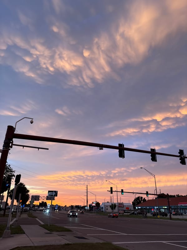 Sunset clouds roll over South Venice streets and rooftops